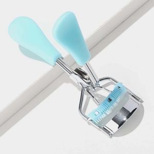 Eyelash curler with comb